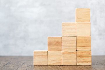 Cube wooden block on the building. Business goal, growth, planning, Risk Management, Solution, strategy Concepts