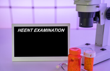 Medical tests and diagnostic procedures concept. Text on display in lab Heent Examination
