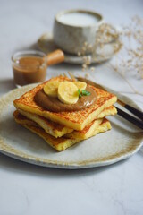 a plate of french toast with jam 