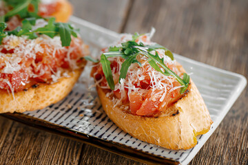 Closeup on portion of gourmet bruschettas appetizer