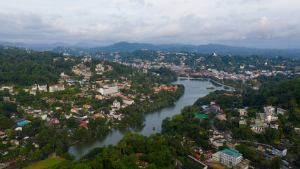 Downtown Kandy with a lake and buildings in the morning view from above.