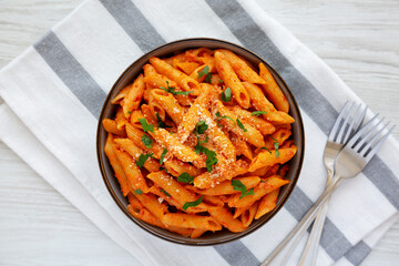 Homemade Penne Alla Vodka from Leftover Sauce with Cheese and Parsley, top view. Overhead, from above, flat lay.