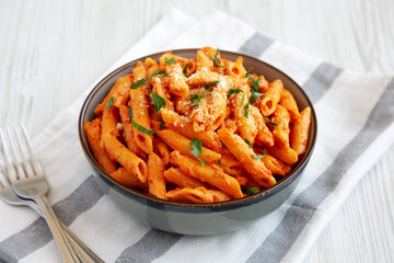 Homemade Penne Alla Vodka from Leftover Sauce with Cheese and Parsley, low angle view.