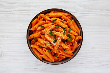 Homemade Penne Alla Vodka from Leftover Sauce with Cheese and Parsley, top view. Overhead, from above, flat lay. - obrazy, fototapety, plakaty