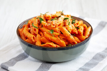 Homemade Penne Alla Vodka from Leftover Sauce with Cheese and Parsley, low angle view.