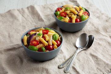 Homemade Fusilli Pasta Salad with Mozzarella and Vegetables, side view.
