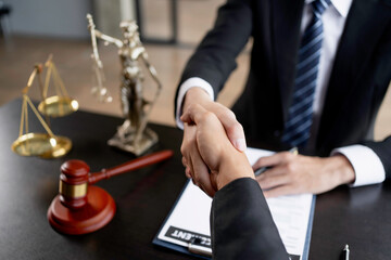 Businessman handshake partner lawyers or attorneys discussing a contract agreement. Business people shaking hands to congratulate success.