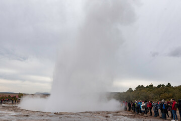 Strokkur geysir in Iceland beside the Hvítá River 