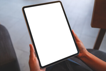 Mockup image of a woman holding digital tablet with blank white desktop screen