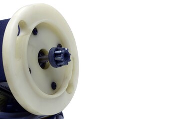 A angle side view of a gear of a drive motor on white bakgrounds. 
