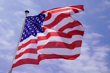 usa flag america red blue white on mat in the wind and blue sky