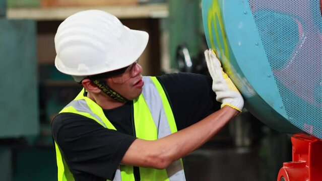 First Aid and safety first concept. Male factory worker arm stuck in machine.