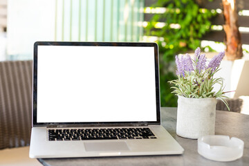 Blank screen desktop computer in minimal office room with decorations and copy space.