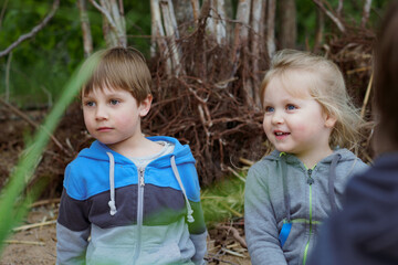 cute little children having fun at camping in countryside