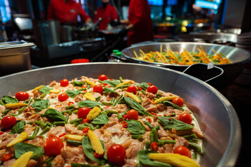 Spanish paella prepared in the street restaurant, close up