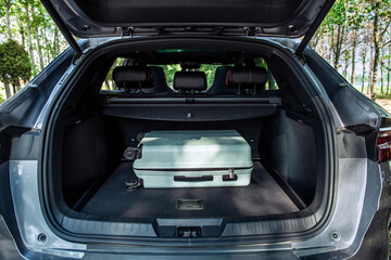 a travel bag in spacious open trunk car