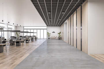 Front view on concrete floor area in modern open space office with lounge sofa, rows of work places with modern computers and wooden decorated walls. 3D rendering