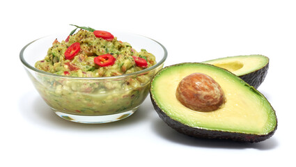 Healthy vegetarian organic guacamole Mexican dip sauce served in glass bowl isolated on white...