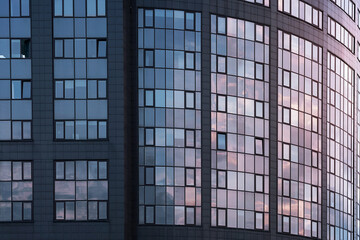 Fototapeta premium Modern building of office center with many windows outdoor. Exterior of contemporary house.