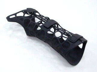 Medical orthopedic plastic prosthesis printed on powder 3D printer isolated on white background....