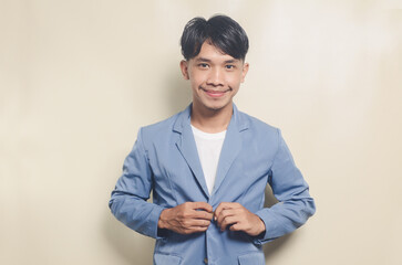 young asian man wearing college suit button-up on isolated background