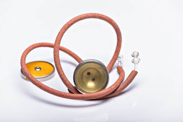 Fototapeta na wymiar Medical Instrument vintage antique stethoscope isolated on white background.