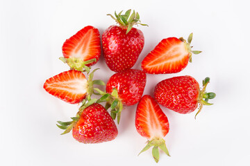 a bunch of ripe strawberries on a white background, close-up