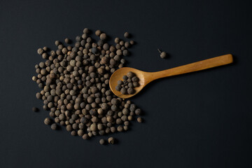 allspice (pimento) isolated on black background 
