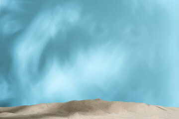 Fototapeta na wymiar sand on a blue background, layout, template