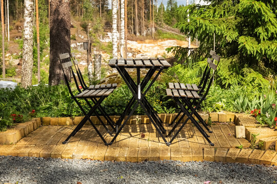 Table and chairs outside. Chair garden outdoor. Outdoor furniture. Furniture for picnics. Photo