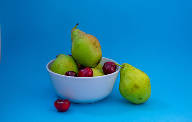 seasonal fruits, summer, fresh pears and cherries. healthy food