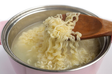 Closeup of Boiling korean instant noodle on pot. Home cooking, Korean food style.