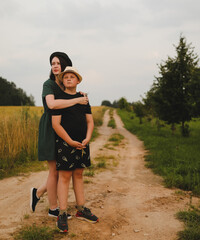 Mother and son outdoors, happy family lifestyle portrait in the park 
