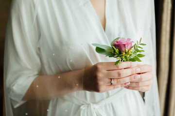 bride holding a bouquet of roses