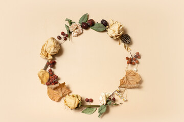 Autumn composition. Wreath made of dried leaves on pastel beige background. Autumn, fall concept. Flat lay, top view, copy space