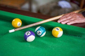 Close-up of a pool player playing pool