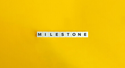 Milestone Word and Banner. Letter Tiles on Yellow Background. Minimal Aesthetics.