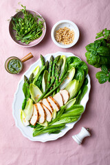 Green asparagus, grilled chicken, pesto, chicory, romen, green peas and pine nuts salad