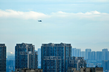 Fototapeta na wymiar skyscrapers and plane in the city