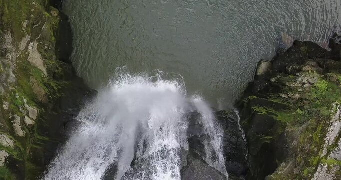 Top drone view on a huge waterfall with rocks and a lake, doubs River, Neuchatel, Switzerland