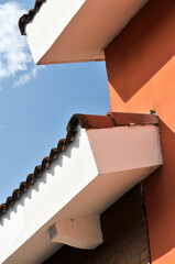 closeup of roof of a house in blue sky