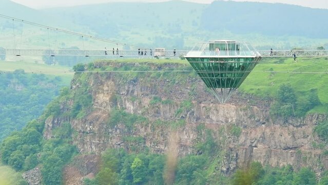 Dashbashi, Georgia - 19th june, 2022: static view Diamond shape platform on glass bridge over scenic dashbashi valley in Georgia countryside. Famous modern bridge over valley in caucasus