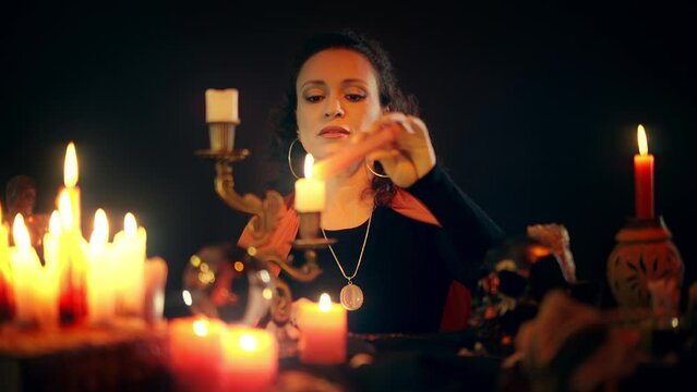 Fortune teller lighting candles, getting ready to communicate with spirit world
