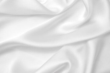 Smooth elegant white silk or satin luxury cloth texture can use as wedding background. Luxurious background design.