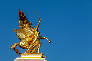 Statue on Alexander III bridge, Paris, France.