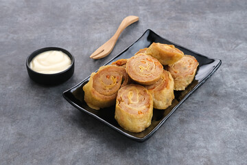Chicken Egg rolls, made from mixtured minced chicken with tapioca, carrots, scallions and eggs then rolled, steamed and fried
