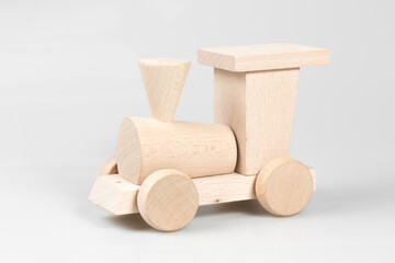 Wooden train with trolleys on white background