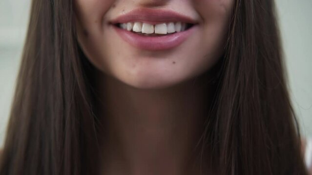 Dental care. Smiling woman. Aesthetic treatment. Unrecognizable pretty lady showing crooked teeth before dentist visit.