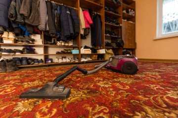 Close-up Of A Vacuum Cleaner Over Carpet