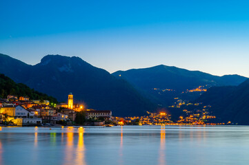 The village of Lezzeno and the panorama of Lake Como, photographed in the evening.
